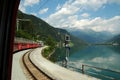 Swiss Red Train Bernina Express at Lake of Poschiavo