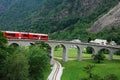 Swiss Red Train Bernina Express pass on Brusio Viaduct, Italy & Switzerland Royalty Free Stock Photo