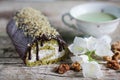 Swiss roll with matcha tea and chocolate icing filled with cream