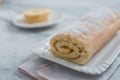 Swiss roll on a plate filled with jam Royalty Free Stock Photo