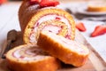 Swiss roll with strawberries and cream, homemde dessert