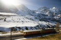 Swiss train with Alps background
