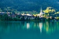 Swiss village Lungern on lake Lungerersee with traditional houses and old church Royalty Free Stock Photo