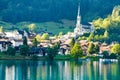 Swiss village Lungern on lake Lungerersee with traditional houses and old church Royalty Free Stock Photo