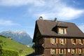 Swiss wooden House in Alps Mountain landscape Royalty Free Stock Photo