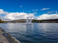 Swiss zurich capital water blue sky some clouds lake fountain spring sunny day background mountain hill switzerland