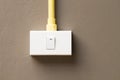 Switch installed on brown wall Royalty Free Stock Photo