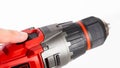 Switch in a modern screwdriver on a drill, close-up. White background, isolate, industry Royalty Free Stock Photo