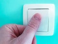 Switch off and on the light with finger close up Royalty Free Stock Photo