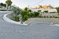 Switchback road to greek town of Kefalos. Royalty Free Stock Photo