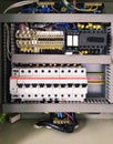 Switchboard with many switches and cables. Power shield lighting. electric connection wires of fuse switch box. Mobile photo