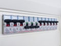 Switches in electrical fuse box. Many black circuit breakers in a row in position ON and three switch in position OFF. Power contr Royalty Free Stock Photo