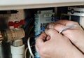 Switching signal wires in the home`s heating system control. Royalty Free Stock Photo