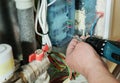 Switching signal wires in the home`s heating system control. Royalty Free Stock Photo