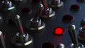 Switching toggle switch on a control panel, red light turns on. 3D rendering
