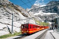 Eigergletscher train station platform with snowy mountain in Switzerland