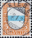 Switzerland - Circa 1922: a postage stamp printed in the Switzerland showing a blue and white coat of arms of the Swiss canton Zug