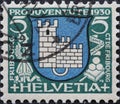 Switzerland - Circa 1930: a postage stamp printed in the Switzerland showing the coat of arms of the city of Freiburg in Switzerla Royalty Free Stock Photo