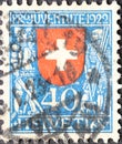 Switzerland - Circa 1922: a postage stamp printed in the Switzerland showing the federal coat of arms of Switzerland with shield h