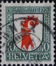 Switzerland - Circa 1926: a postage stamp printed in the Switzerland showing a red horn on the coat of arms of the canton of Basel Royalty Free Stock Photo