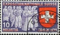 Switzerland - Circa 1939: a postage stamp printed in the Switzerland showing some Swiss people who are bringing their work to the