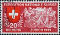 Switzerland - Circa 1939: a postage stamp printed in the Switzerland showing some tourists and shepherds listening to a poet. Stat