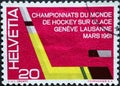 Switzerland - Circa 1961 : a postage stamp printed in the swiss showing aa yellow ice hockey stick and puck. Text. European and Wo