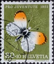 Switzerland - Circa 1951 : a postage stamp printed in the swiss showing an aurora butterfly Anthocharis cardamines on meadowfoam