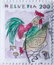 Switzerland - Circa 1994 : a postage stamp printed in the swiss showing a Cocks hen and chicks