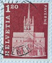 Switzerland - Circa 1968 : a postage stamp printed in the swiss showing the collegiate church in Payerne Royalty Free Stock Photo