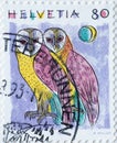 Switzerland - Circa 1991 : a postage stamp printed in the swiss showing a drawing with two owls