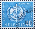 Switzerland - Circa 1957 : a postage stamp printed in the swiss showing the emblem of the World Health Organization globe with the