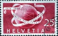 Switzerland - Circa 1949 : a postage stamp printed in the swiss showing a globe with tapes: World Postal Union
