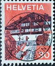 Switzerland - Circa 1973 : a postage stamp printed in the swiss showing a graphic representation of Erlenbach in the Simmental in