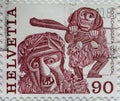 Switzerland - Circa 1977 : a postage stamp printed in the swiss showing a New Year`s Eve costume, RoitschÃÂ¤ggÃÂ¤tÃÂ¤ LÃÂ¶tschenta