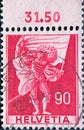 Switzerland - Circa 1941 : a postage stamp printed in the swiss showing an outline of a historical standard bearer with war armor