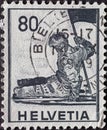 Switzerland - Circa 1941: a postage stamp printed in the swiss showing a sculpture of a dying soldier with a flag. Museum in Genev