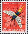 Switzerland - Circa 1955 : a postage stamp printed in the swiss showing the wood wasp Sirex gigas on pine branch