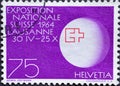 Switzerland - Circa 1963 : a postage stamp printed in the swiss showing a world globe with Expo symbol and inscription. Text: Expo