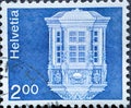 Switzerland - Circa 1974 : a postage stamp printed in the swiss showingArchitecture and arts and crafts a bay window on a building