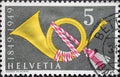 Switzerland - Circa 1949: a postage stamp printed in the Switzerland showing a historic post horn. 100 years of Swiss Post