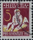 Switzerland - Circa 1927: a postage stamp printed in the Switzerland showing a neglected child. charity postage stamp . Pestalozzi Royalty Free Stock Photo