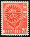SWITZERLAND - CIRCA 1964: stamp 20 Swiss centimes printed by Swiss Confederation, shows Stylized flower of 22 leaves Royalty Free Stock Photo