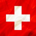 Switzerland country flag on silk or silky waving texture Royalty Free Stock Photo