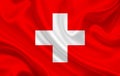 Switzerland country flag on wavy silk fabric background panorama Royalty Free Stock Photo