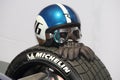 Switzerland; Geneva; March 8, 2018; The close up of racing helmet with googles and leather racing gloves on Michelin tire.; The 8