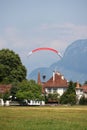 SWITZERLAND, INTERLAKEN, AUGUST 02, 2022 - Tourists paragliding in Interlaken, Bernese Oberland, Switzerland