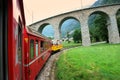 Switzerland: July 2012, Famous red alpine train Bernina Express from St.Moritz to Tirano near Brusio Viaduct in Italy