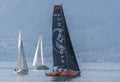 Switzerland: An orange and black sailing boat