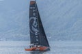 Switzerland: An orange and black sailing boat